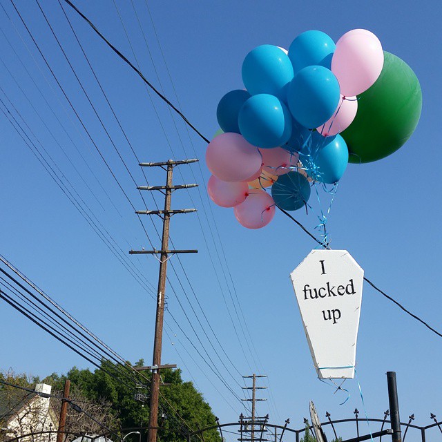 Garth Elson floating one of his styrofoam coffins in Los Angeles